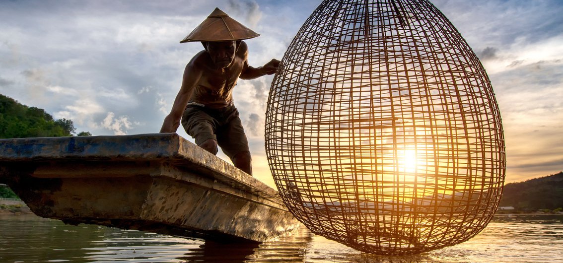 Fischer auf dem morgendlichen Mekong